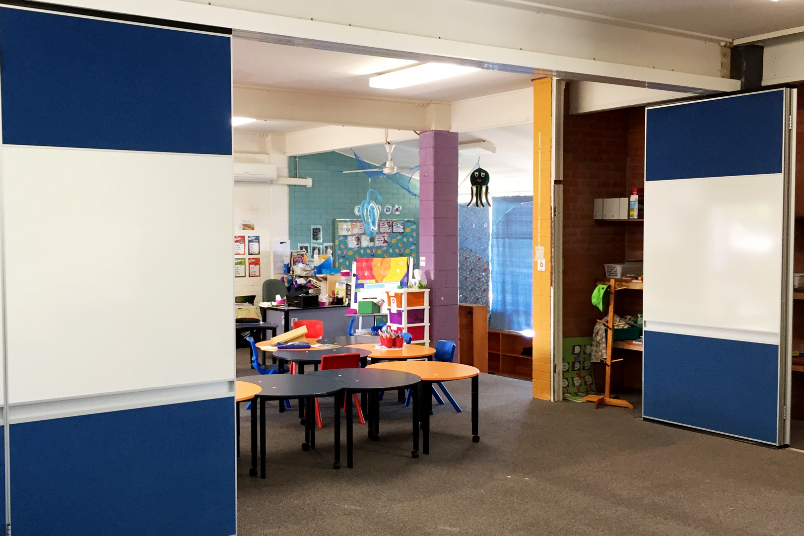 solid operable wall with whiteboards and pen tray