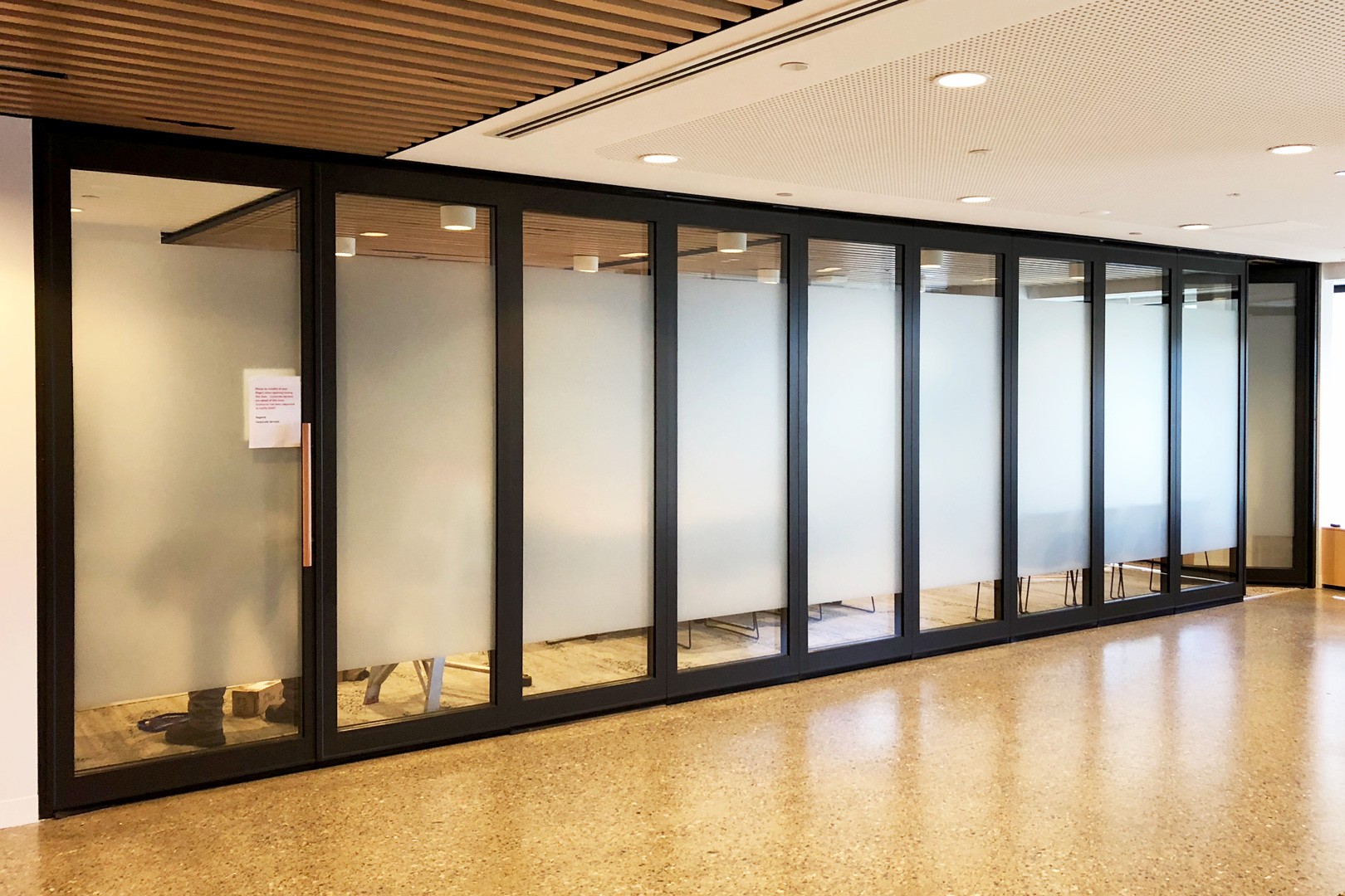 commercial fitout with glazed operable wall