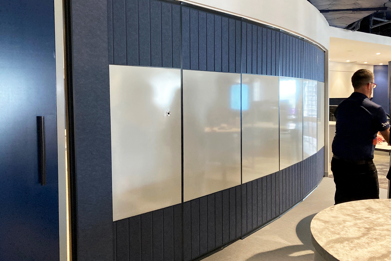 internal fitout curved operable wall with fabric and whiteboard insets