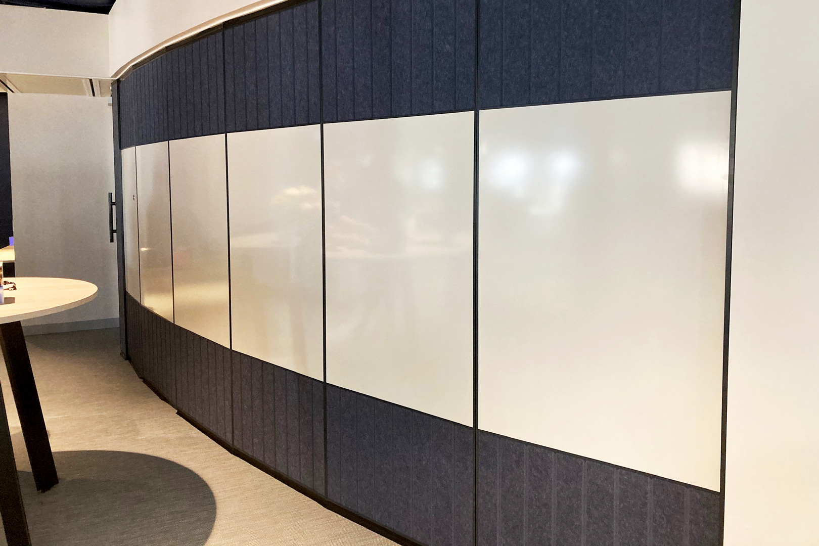curved operable wall with fabric and whiteboard insets