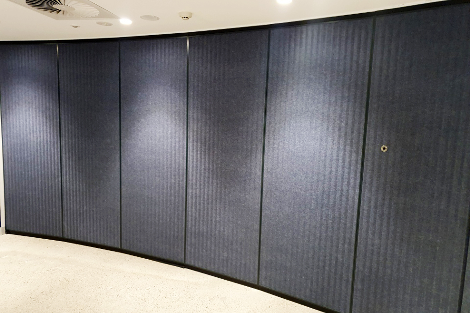 curved operable wall with fabric panels