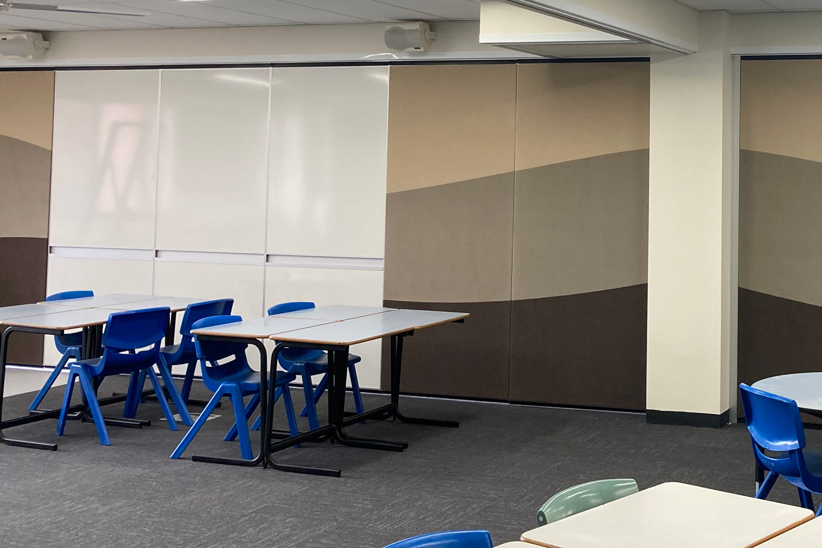 operable wall with whiteboards and fabric panels