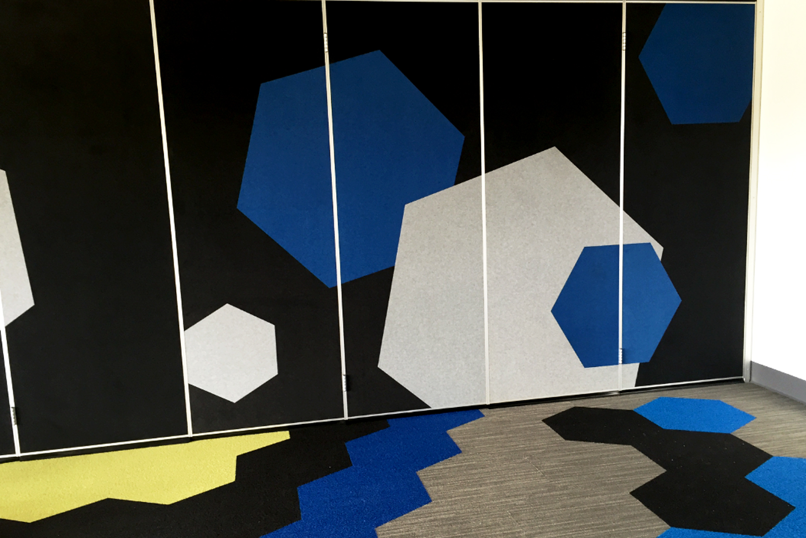 solid operable wall with fabric panels