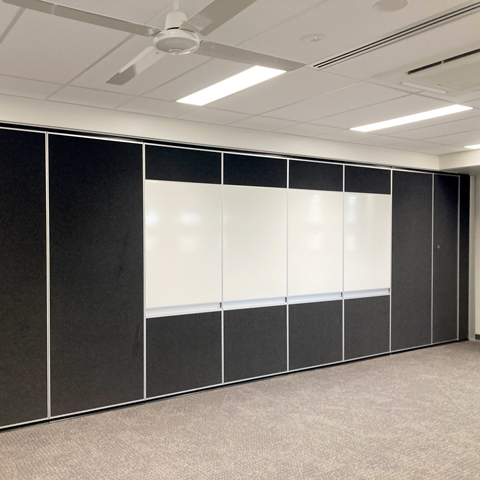 With-Pen-Rail solid operable wall with inset whiteboard with pen rail
