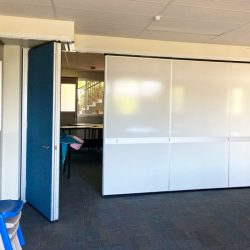 operable wall with whiteboards and inset pen tray