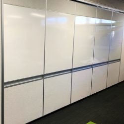 solid operable wall with white boards and pen trays